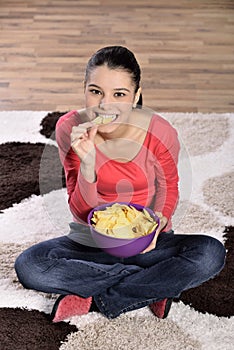 Beautiful woman eating junk food