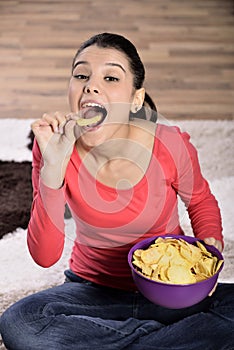 Beautiful woman eating junk food