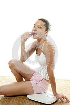 Beautiful woman eating a red strawberry