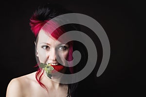 Beautiful woman eating strawberry