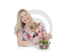 Beautiful woman eating vegetable salad