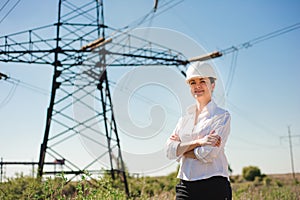 Beautiful woman engineer work at an electrical substation.