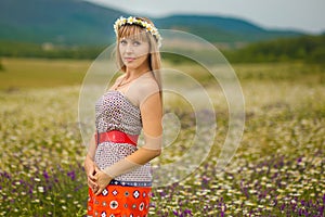 Beautiful woman enjoying daisy field, nice female lying down in meadow of flowers, pretty girl relaxing outdoor, having fun, holdi