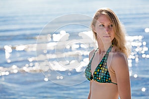 Beautiful woman enjoying herself at the beach the beach