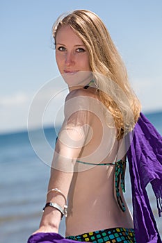 Beautiful woman enjoying herself at the beach the beach