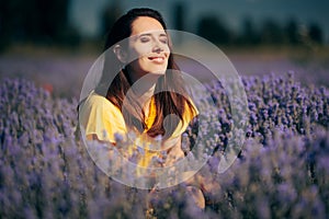 Beautiful Woman Enjoying Sunshine in a Lavender Field