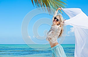 Beautiful woman enjoying vacation in tropical destination photo