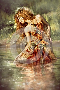 Beautiful woman enjoys the water.