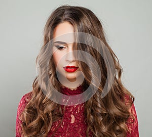 Beautiful Woman with Event Makeup and Long Healthy Wavy Hair