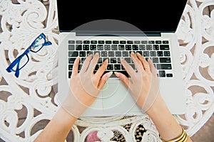 Beautiful Woman Explore Online Shopping Website. Close up hands of young woman shopping online by using laptop and reading online