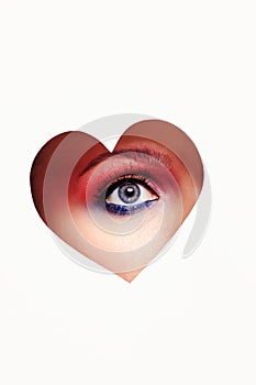 Beautiful woman eye inside heart
