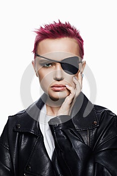 Beautiful woman with eye patch and short pink hair. beauty young woman in leather
