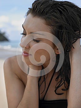 Beautiful Woman With Eyes Closed At Beach