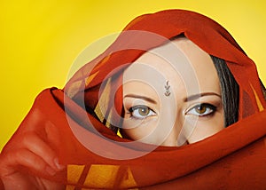 Beautiful woman eyes in indian traditional bindi