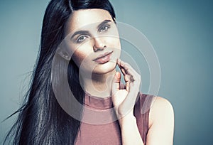 Beautiful woman face close up portrait young curly hair studio o