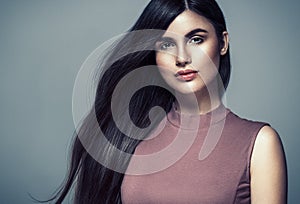 Beautiful woman face close up portrait young curly hair studio o