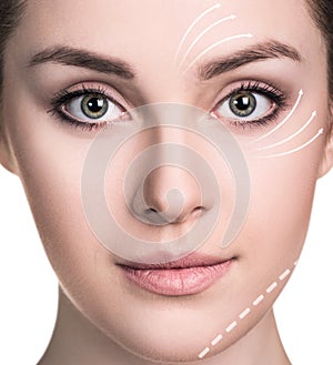 Beautiful woman face with correction lines.