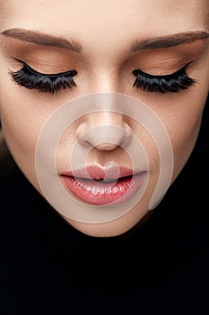 Beautiful Woman With Face Makeup And Long Black Eyelashes