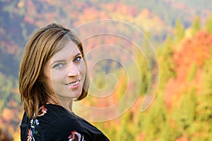 Beautiful Woman face Portrait with autumn landscape background
