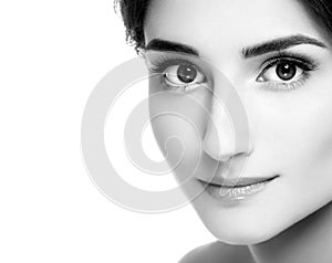 Beautiful woman face portrait with curly hair. Black and white.