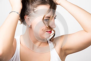 Beautiful woman face portrait with red lips, unruly curl