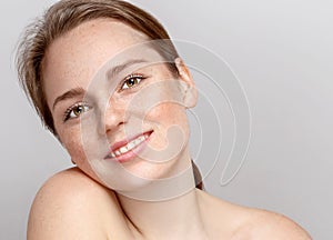 Beautiful woman face portrait young gray background