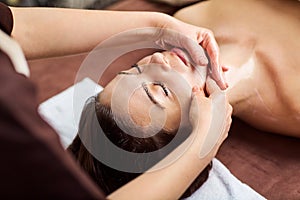 Beautiful woman at a facial massage at a spa salon