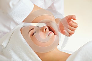 Beautiful woman at a facial massage at a spa salon