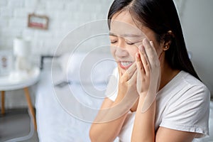 Beautiful woman feeling tooth pain