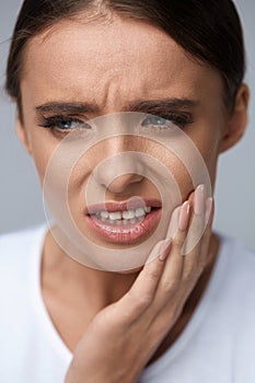 Beautiful Woman Feeling Tooth Pain, Painful Toothache. Health