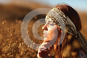 Beautiful Woman on a Field in Summertime