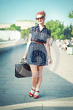 Beautiful woman in fifties style with braces smiling