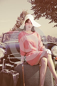 Beautiful woman in fifties style, road trip