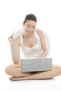 Beautiful woman on floor with laptop computer