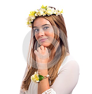 Beautiful woman with a flower garland and a white dress