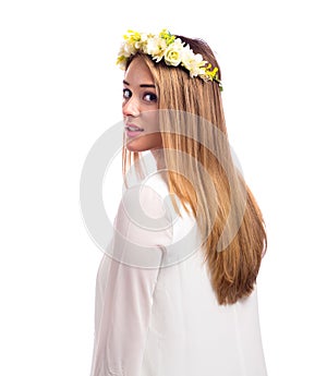 Beautiful woman with a flower garland and a white dress