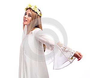 Beautiful woman with a flower garland and a white dress