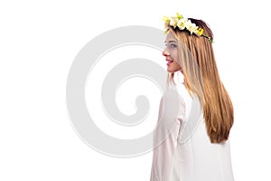 Beautiful woman with a flower garland and a white dress