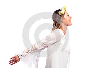 Beautiful woman with a flower garland and a white dress