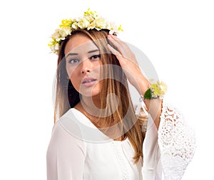 Beautiful woman with a flower garland and a white dress