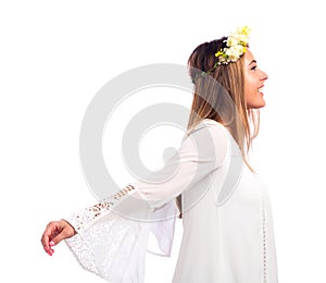 Beautiful woman with a flower garland and a white dress