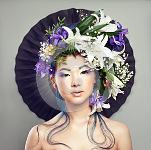 Beautiful Woman with Flower on her Head and Creative Makeup