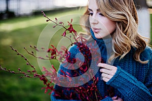 Beautiful woman with flower near face