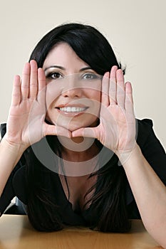 Beautiful woman framing face