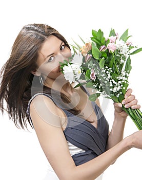 Beautiful woman with fresh bouquet of flowers