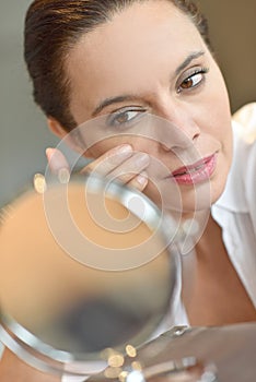 Beautiful woman in front of mirror