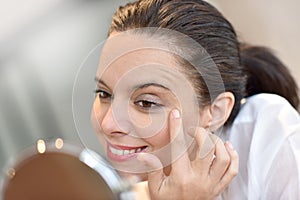 Beautiful woman in front of mirror