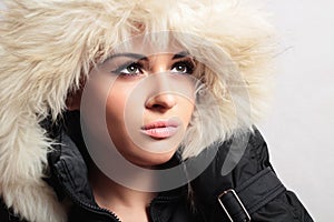 Beautiful woman with fur. white fur hood. winter style. make-up. fashion beauty girl.