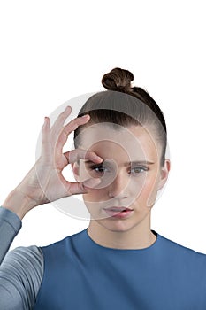 Beautiful woman gesturing against white background