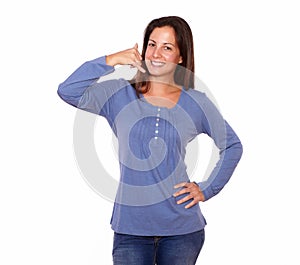 Beautiful woman gesturing call me sign with hand